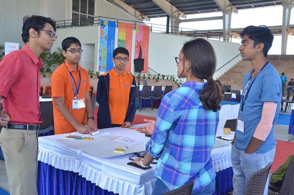 Students presenting ideas at Changemaker Challenge 2024